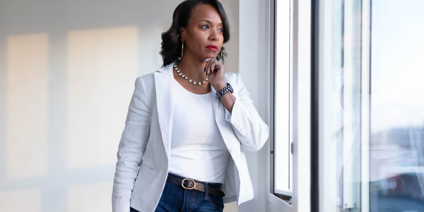 A woman looking out of the window pondering life