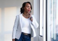 A woman looking out of the window pondering life