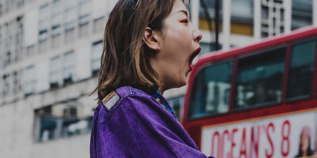 Woman yawning: Exhausted for no apparent reason?