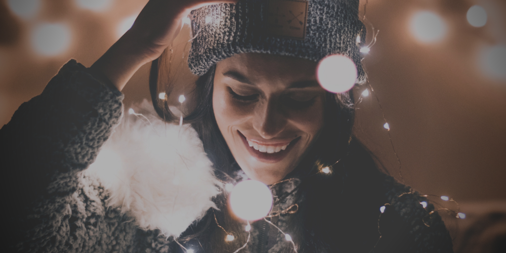 Woman with lights: How to find the hidden magic of the holiday season