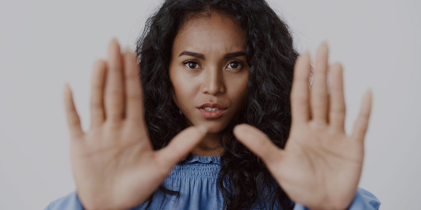 victim-abuse-danger-women-concept-closeup-alarmed-seriouslooking-african-american-curlyhaired-woman-stretch-hands-forward-stop-motion-say-no-enough-rejecting-something