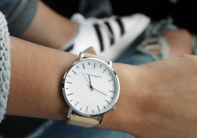 Woman wearing wristwatch: time management tools for women